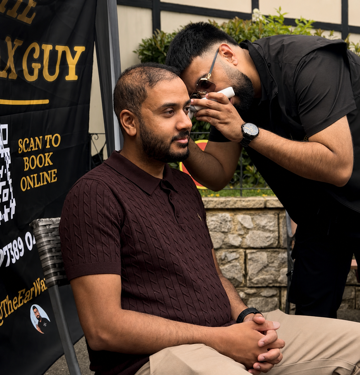 Professional ear examination at a community event