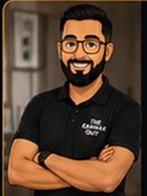 The Earwax Guy mascot with arms folded
